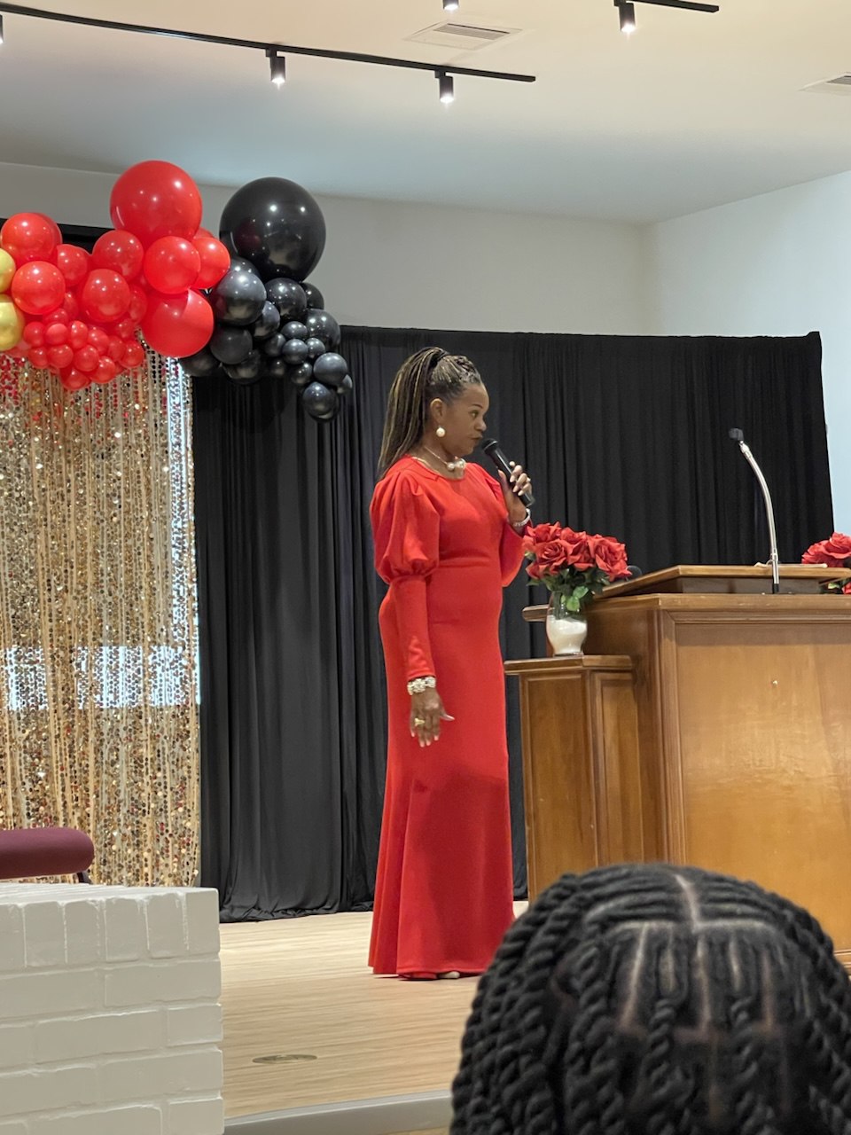 Sophia Graendison speaking at community event